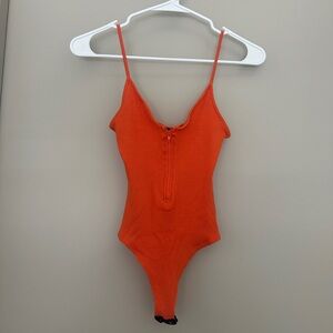 Windsor orange ribbed bodysuit with zipper